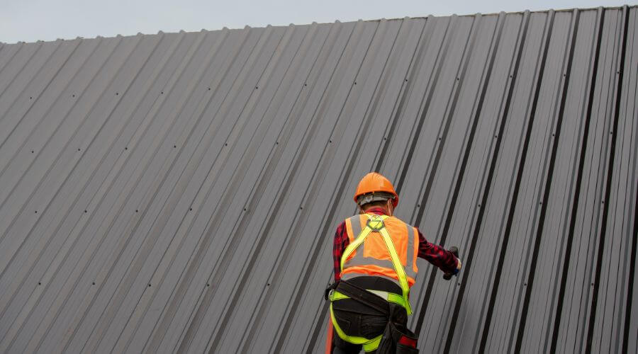 Professional metal roof installation services in La Harpe, KS